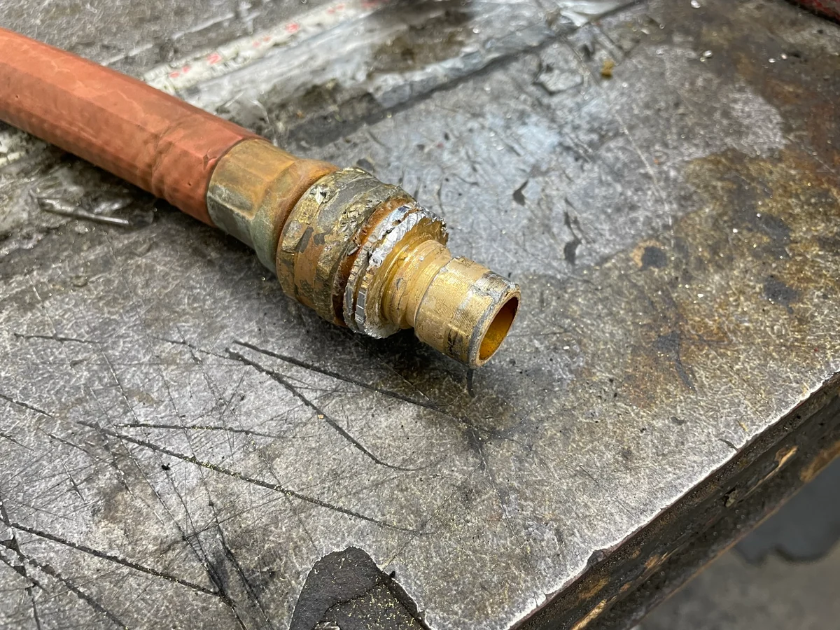 why does my brass hose nozzle get stuck to aluminum spigot